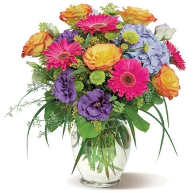 Colorful bouquet featuring roses, gerberas, lisianthus, and hydrangeas with lush greenery in a glass vase.