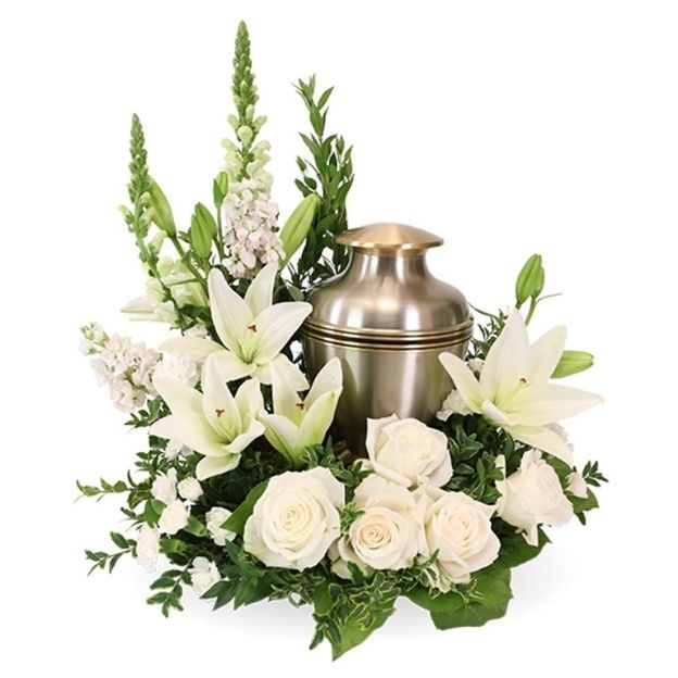 Elegant sympathy display with white flowers encircling a metallic urn, symbolizing peace and remembrance.