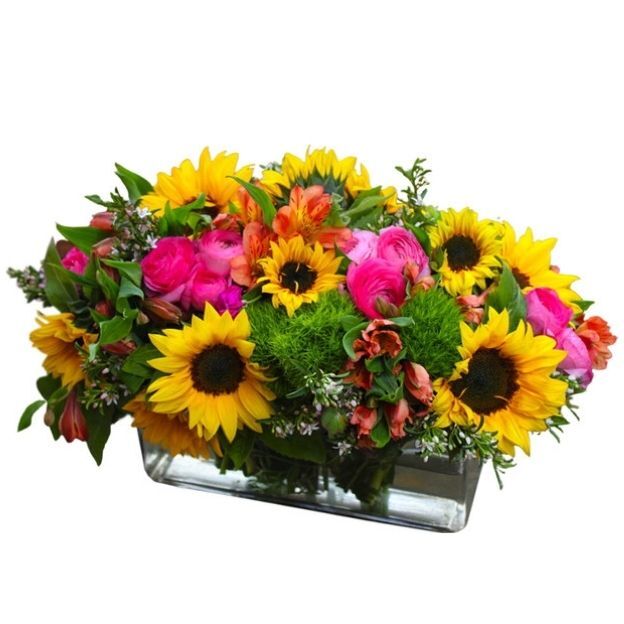 Rectangular glass vase with sunflowers, hot pink roses, green dianthus, alstroemeria, and lush greens.